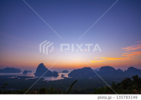 aerial view stunning red sunrise over Samed Nang Chee Phang Nga archipelago. aerial view stunning red sunrise over Samed Nang Chee Phang Nga archipelago. 135783149