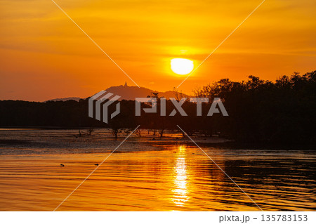 Scenery of golden Sunset above the ocean Scenery of golden Sunset above the ocean 135783153