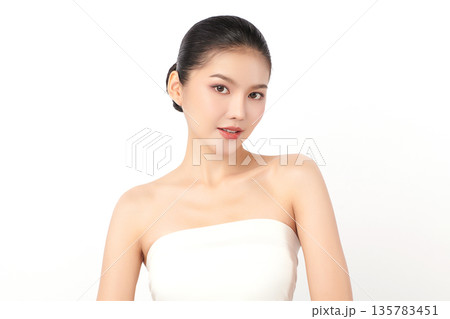 A beautiful young Asian woman with clean, fresh skin against a white background. Skincare, facial treatment, cosmetology, beauty, and spa. An elegant portrait of an Asian woman. A beautiful young Asian woman with clean, fresh skin against a white background. Skincare, facial treatment, cosmetology, beauty, and spa. An elegant portrait of an Asian woman. 135783451