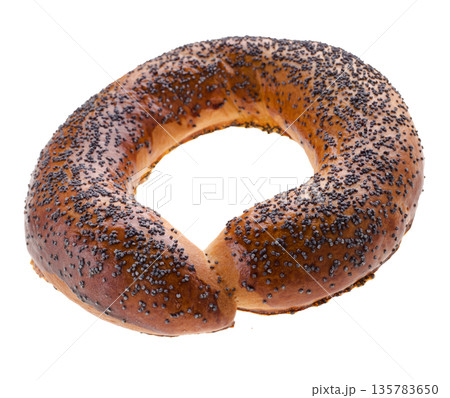 Ruddy bagel with top sprinkled with poppy seeds, on a white background in isolation 135783650