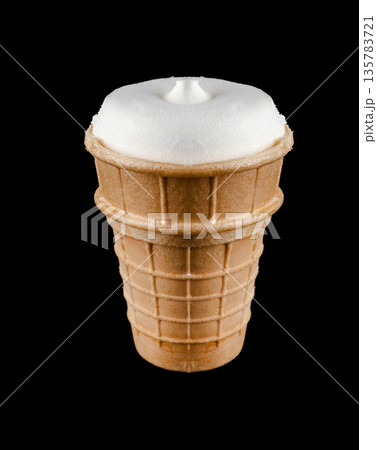 ice cream in a waffle cup, on a black background isolated 135783721
