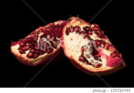 Pomegranate, citrus fruit on a black background isolated Pomegranate, citrus fruit on a black background isolated 135783745