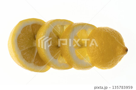 Ripe lemon sliced into rings and stacked in a row on a white background isolated Ripe lemon sliced into rings and stacked in a row on a white background isolated 135783959