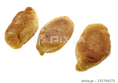 Fried homemade pies, collage, on a white background in isolation 135784273