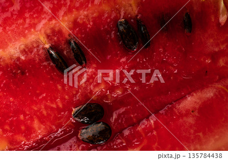 Ripe watermelon pulp and watermelon seeds, close up 135784438