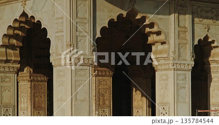 Red Fort Mughal arches and marble columns with dramatic shadow light contrast architectural detail Red Fort Mughal arches and marble columns with dramatic shadow light contrast architectural detail 135784544