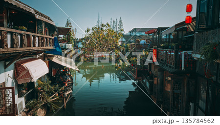 Lively riverside dining with floating greenery and traditional architecture. Zhujiajiao, Shanghai, China 135784562