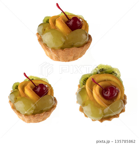 Dessert, fruit cake, with cherry grapes and orange slices on a white background in isolation, collage 135785862