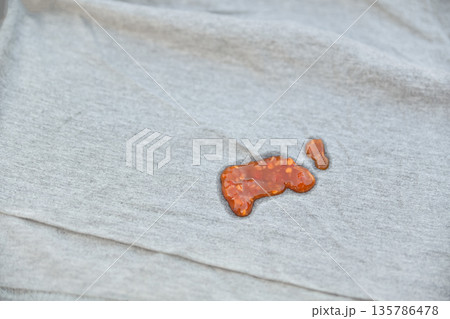 dirty spicy sauce stain on fabric for cleaning concept dirty spicy sauce stain on fabric for cleaning concept 135786478