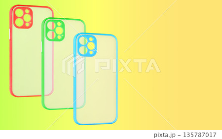 silicone phone case partially transparent, yellow background, space for text 135787017