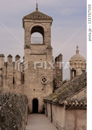 A tall tower with a small window on the top A tall tower with a small window on the top 135787509