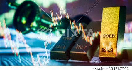 Gold Bullion Bar Closeup With Falling Candlestick Chart Overlay Precious Metal Price Drop, Market Volatility, Trading Risk, Inflation Hedge, and Economic Uncertainty Finance Concept 135787706