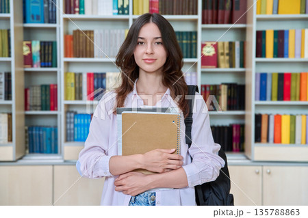 Portrait of teenage female student inside library classroom 135788863