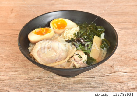 Tonkotsu Chashu ramen orJapanese yellow noodles topping slice braised pork with boiled egg and seaweed in Miso soy sauce on bowl 135788931