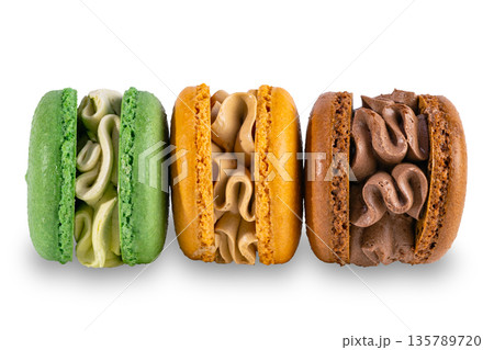 Row of macarons creamy isolated on white background Row of macarons creamy isolated on white background 135789720