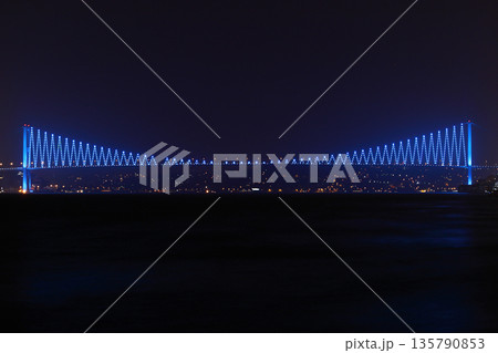 Istanbul Bosphorus Bridge. with blue lights at night. 135790853