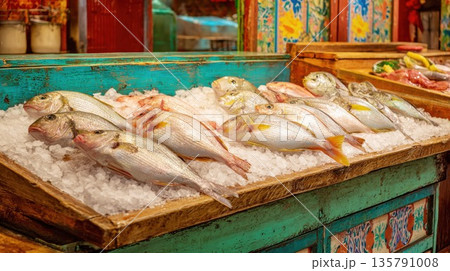 Fresh raw fish displayed on ice in a rustic colorful market stall 135791008