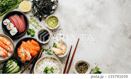 Japanese sushi ingredients and fresh sashimi arranged on stone table 135791039