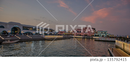 Doha, Qatar - January 19 2026: Old Doha port (Mina District) sunset shot showing cafe and restaurants with locals and visitors walking Doha, Qatar - January 19 2026: Old Doha port (Mina District) sunset shot showing cafe and restaurants with locals and visitors walking 135792415