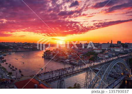 Scenic view of Porto city during sunset with a bridge over the river in Portugal. 135793037