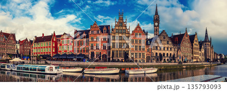 Ghent city historical center, tourists boats and colorful buildings on Leie river bank, Belgium 135793093