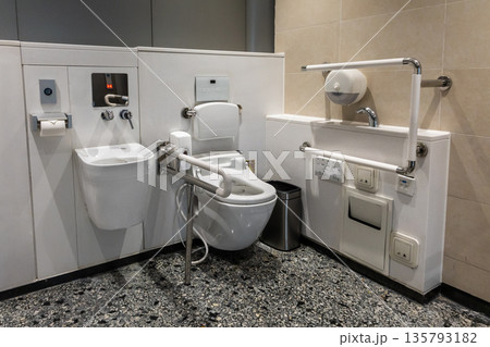 Comprehensive generic disability friendly restroom toilet sanitary with hand rails, bars and aids. Comprehensive generic disability friendly restroom toilet sanitary with hand rails, bars and aids. 135793182