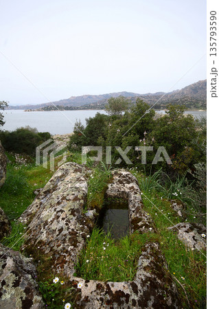 Ruined walls of castle over the lake Bafa in a nature reserve situated in southwestern Turkey 135793590