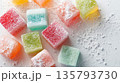 Vibrant Turkish delight sweets are dusted with sugar on white 135793730