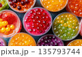 Colorful popping boba cups arranged for refreshing desserts 135793744