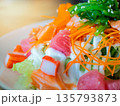 Japanese salad, Raw salmon, tuna, shrimp roe or flying fish roe (tobiko) and crab sticks topped with mayonnaise and seaweed. 135793873