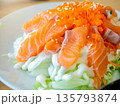 Japanese salad, raw salmon and mayonnaise topped with shrimp roe or flying fish roe (tobiko). Japanese food. 135793874