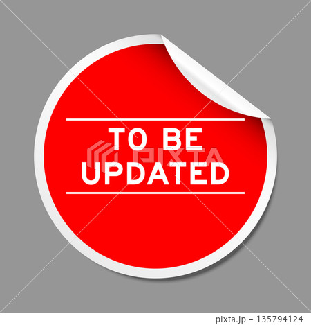 Red color peel sticker label with word to be updated on gray background Red color peel sticker label with word to be updated on gray background 135794124
