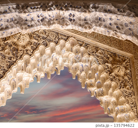 Arches in Islamic (Moorish) style (against the sunset) in Alhambra, Granada, Spain Arches in Islamic (Moorish) style (against the sunset) in Alhambra, Granada, Spain 135794622