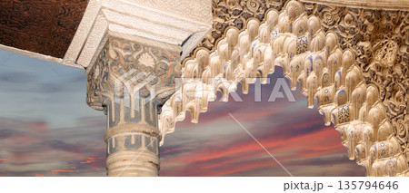 Arches in Islamic (Moorish) style (against the sunset) in Alhambra, Granada, Spain  135794646