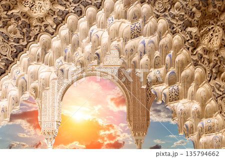 Arches in Islamic (Moorish) style (against the sunset) in Alhambra, Granada, Spain  135794662