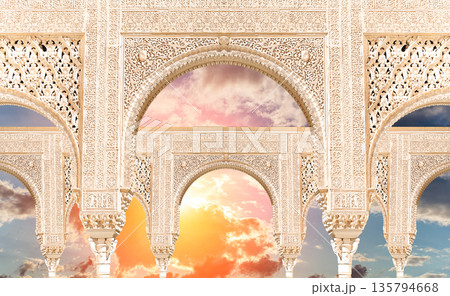 Arches in Islamic (Moorish) style (against the sunset) in Alhambra, Granada, Spain  135794668
