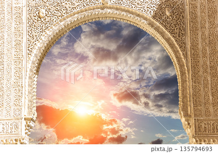 Arches in Islamic (Moorish) style (against the sunset) in Alhambra, Granada, Spain Arches in Islamic (Moorish) style (against the sunset) in Alhambra, Granada, Spain 135794693