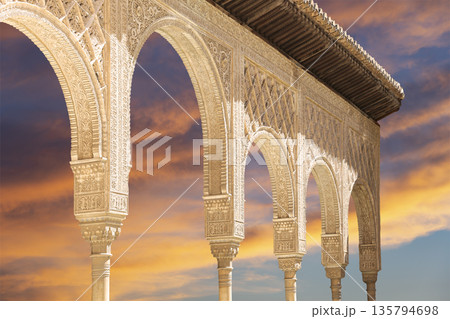 Arches in Islamic (Moorish) style (against the sunset) in Alhambra, Granada, Spain  135794698