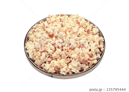 Popcorn on plate isolated on white background. Popcorn on plate isolated on white background. 135795444