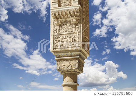 Columns in Islamic (Moorish) style in Alhambra (against the background of a beautiful sky with clouds), Granada, Spain Columns in Islamic (Moorish) style in Alhambra (against the background of a beautiful sky with clouds), Granada, Spain 135795606