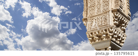 Columns in Islamic (Moorish)  style in Alhambra (against the background of a beautiful sky with clouds), Granada, Spain 135795615