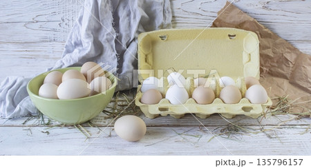 Fresh farm eggs in rustic style on a wooden table. Assortment of fresh farm eggs. Fresh farm eggs in rustic style on a wooden table. Assortment of fresh farm eggs. 135796157