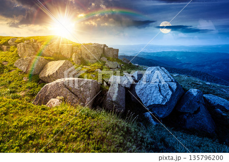 mountain landscape in summer with rocks. day and night time change concept. grass under sky with sun and moon at twilight. alpine meadow and rolling hills with boulders. equality and shift template mountain landscape in summer with rocks. day and night time change concept. grass under sky with sun and moon at twilight. alpine meadow and rolling hills with boulders. equality and shift template 135796200