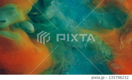 Mist swirling. Abstract fog. Defocused blue orange colorful paint in water cloud fluid liquid floating on ethereal chemical background. Mist swirling. Abstract fog. Defocused blue orange colorful paint in water cloud fluid liquid floating on ethereal chemical background. 135796232