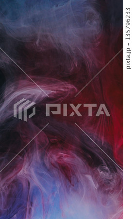 Vapor art. Mist ink. Blur red crimson blue colorful paint in fume water chemical liquid floating on abstract creative background.. 135796233