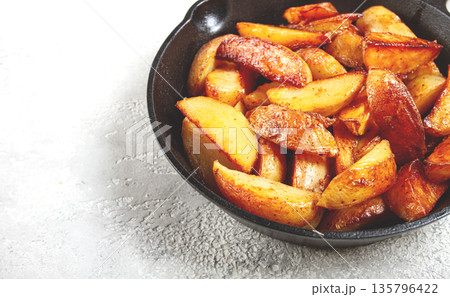 fried potato slices, in a cast-iron pan, homemade, no people, fried potato slices, in a cast-iron pan, homemade, no people, 135796422