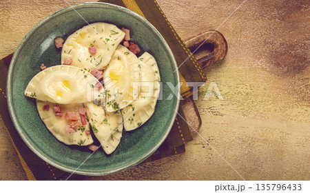 Dumplings, with fried prosciutto, a traditional dish of Polish cuisine, dumplings, top view, close-up, without people, 135796433