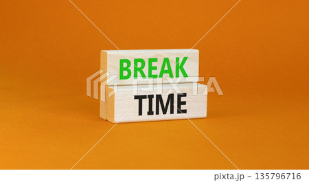 Break time symbol. Concept word Break time on beautiful wooden blocks. Beautiful orange paper background. Business break time concept. Copy space. 135796716