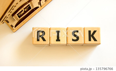 Risk symbol. Concept word Risk on beautiful wooden blocks. Beautiful wooden house. Beautiful white table white background. Business, lifestyle, support and risk concept. Copy space. Risk symbol. Concept word Risk on beautiful wooden blocks. Beautiful wooden house. Beautiful white table white background. Business, lifestyle, support and risk concept. Copy space. 135796766
