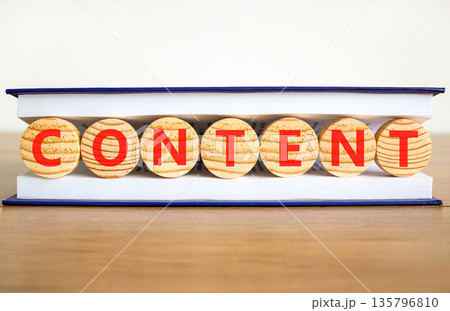 Content symbol. Concept word Content on beautiful wooden circles in book. Beautiful wooden table white background. Business content concept. Copy space. 135796810